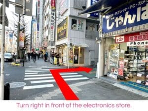 Turn right in front of the electronics store.